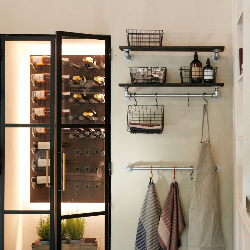 Wine closet in kitchen with wall mounted iron hooks to present your favourite wines