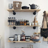wall mounted display shelves in store for cups, spices in industrial design with dark iron supports
