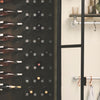 Open wine closet made from individual iron hooks wall mounted made from dark water pipes