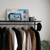Clothing rack in modern industrial design from dark iron pipes with hook for hats