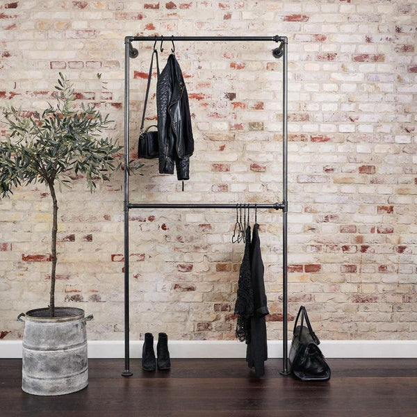 Wall mounted rack for clothes with double hanging rail made from dark water pipes industrial design