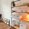 Free standing shelving system open for storage with boxes and stable due to strong iron pipes modern design