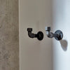 Wall mounted clothes hook made from dark iron pipes for towels and bags