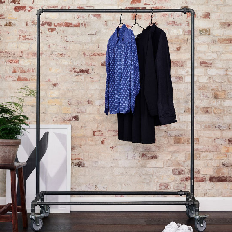 modern clothes rack with four wheels for maximum flexibility made from strong dark iron pipes