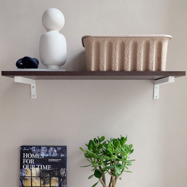 Wall mounted shelf made from smoked oak white metal supports for decorations