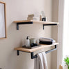 Modern bathroom set up with wall mounted shelves in classic oak with black supports rustfree for towels