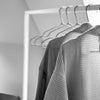 clothes rail made from square white metal pipes modern monochrome design