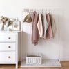 modern clothes rack in white with marble bottom for minimalistic interior design
