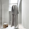free standing clothes rack for bathrobes in spa for guests monochrome design