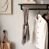 wall mounted clothes hook and rail made from black square metal pipes for bags and jackets