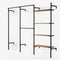 Walk In system with a row with one rail for long clothes, a row with two rails for shorter clothes and a row with four height-adjustable shelves in classic oak veneer