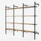 Shelving system in black powder coating with 3 sections with 4 oak veneer shelves in classic oak in each section.