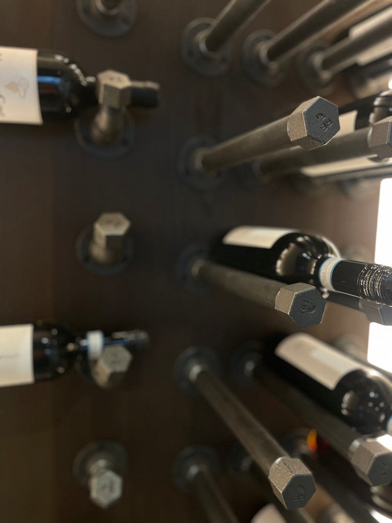 Modern iron pin made from water pipes used for wine storage wall mounted and stable