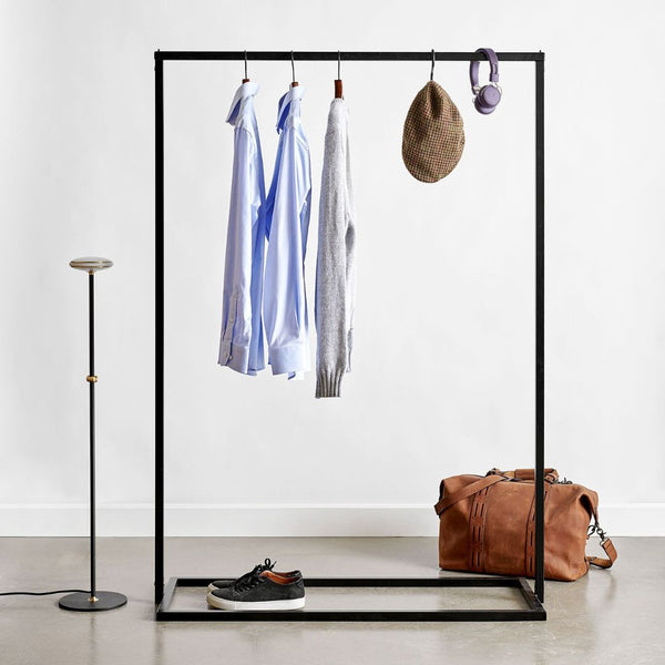 Free standing clothes rack made from black iron pipes stable and modern design
