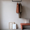 ceiling mounted clothes rail made from black iron pipes in square modern design