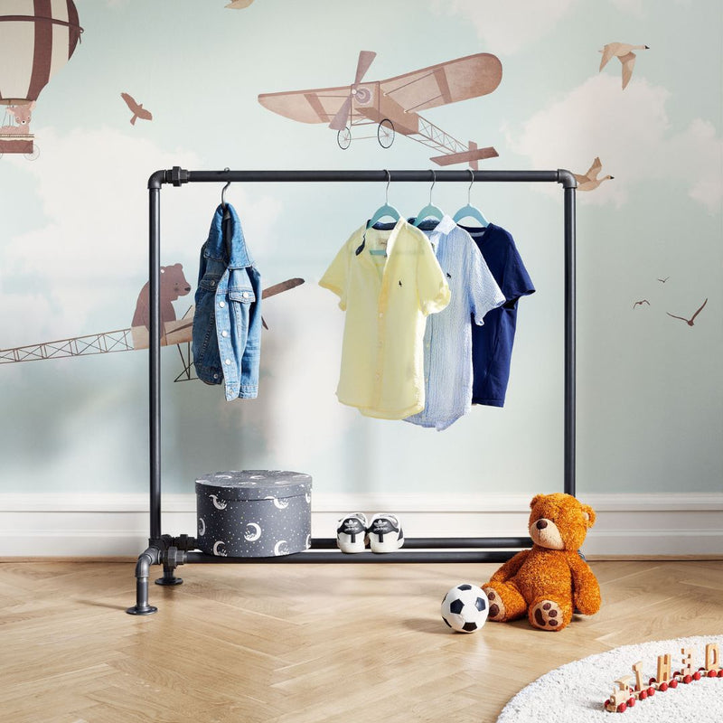 Modern closet for children made from dark water pipes with rail and shoe rack