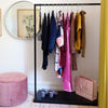 Free standing display rack made from black iron pipes and black marble plate as open wardrobe