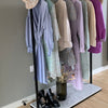 free standing display rack for clothing store made from strong iron pipes in black with marble plate