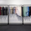 Open display racks perfect for modern clothing store made with black iron pipes and black marble plate