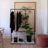 Free standing clothes rack with black iron pipes square and marble plate minimalistic design