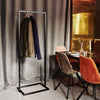Free standing clothes rack in restaurant for coats and jackets black iron pipes
