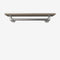 Wall-mounted clothes rail made with silver pipes and wooden shelf in smoked oak