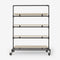 Clothes rack on wheels made with dark pipes and with shelves in light pine