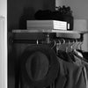 Wall mounted clothes rail for jackets and hats in the entrance with shelf on top for decoration