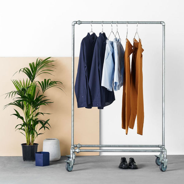 Practical clothes rack on wheels made from sturdy silver water pipes for industrial design