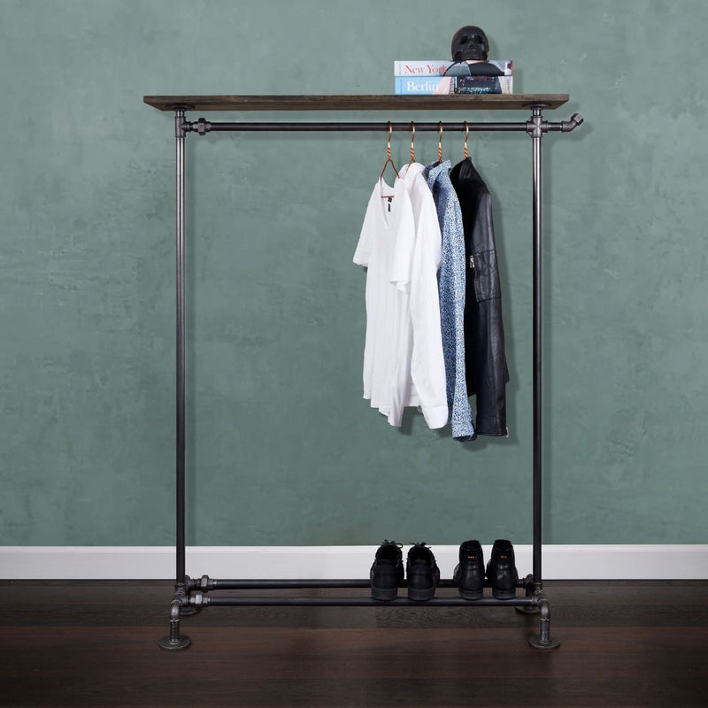 Free standing rack made from dark iron pipes with shoe rack and oak shelf to place decoration