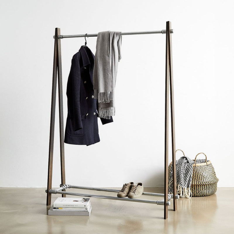 scandinavian style clothes rack free standing with silver water pipes and smoked oak supports