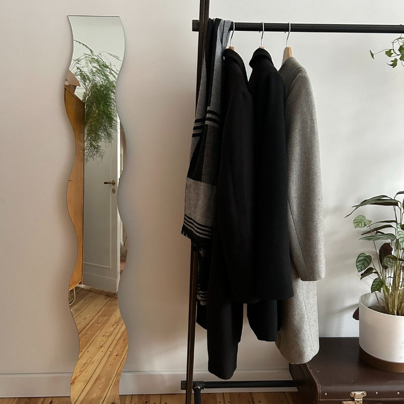 Free standing clothes rack for the entrance with rail from water pipes to hang jackets and shoe rack