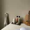 white wall mounted clothes hook for towels in the kitchen or the bathroom