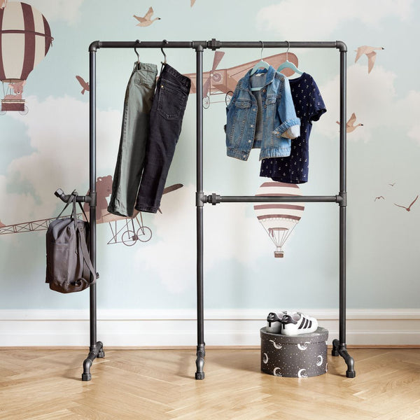 Free standing clothing rack for children made from dark water pipes in industrial design