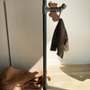 Free standing clothing rack from industrial waterpipes dark with hook to hang clothes