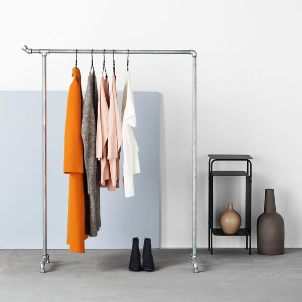 Free standing simple rack made from silver water pipes with little hook for extra space modern