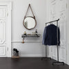  renter friendly entrance design with free standing clothes rack for jackets and hooks for bags and umbrella