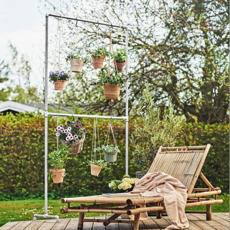 Free standing clothes rack from rustfree iron pipes for hanging plants outdoors on the terracce
