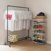 Free standing clothes rack made from strong iron pipes industrial design dark pipes