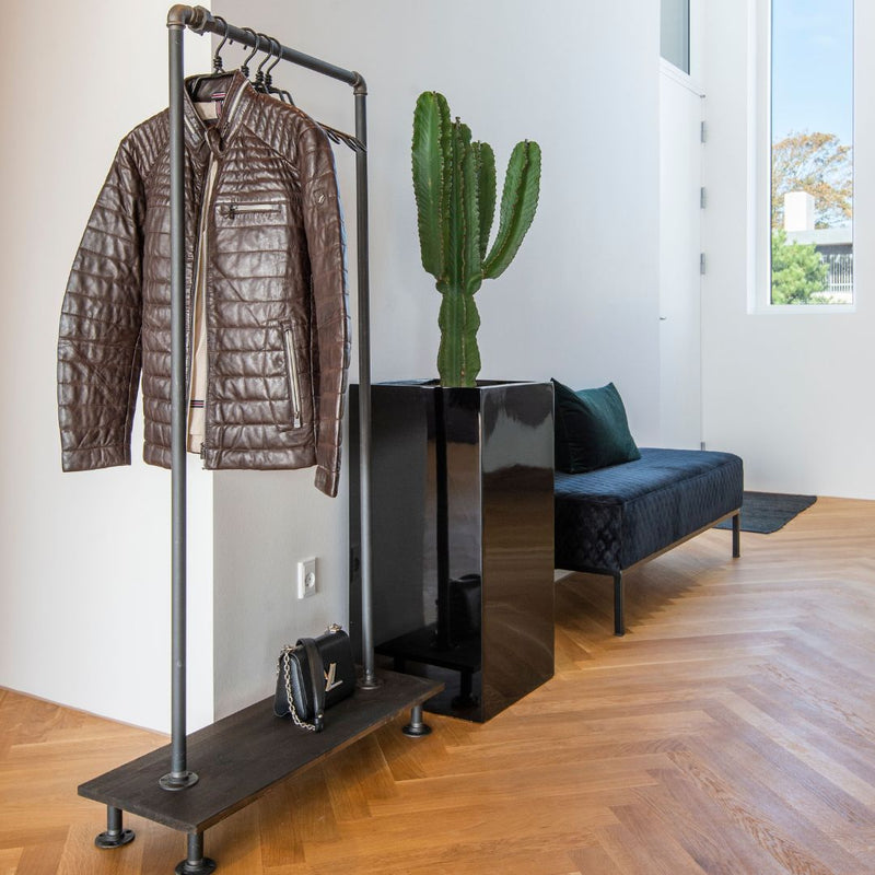 free standing modern industrial rack made with dark pine shelf for shoes and dark water pipes for hanging clothes