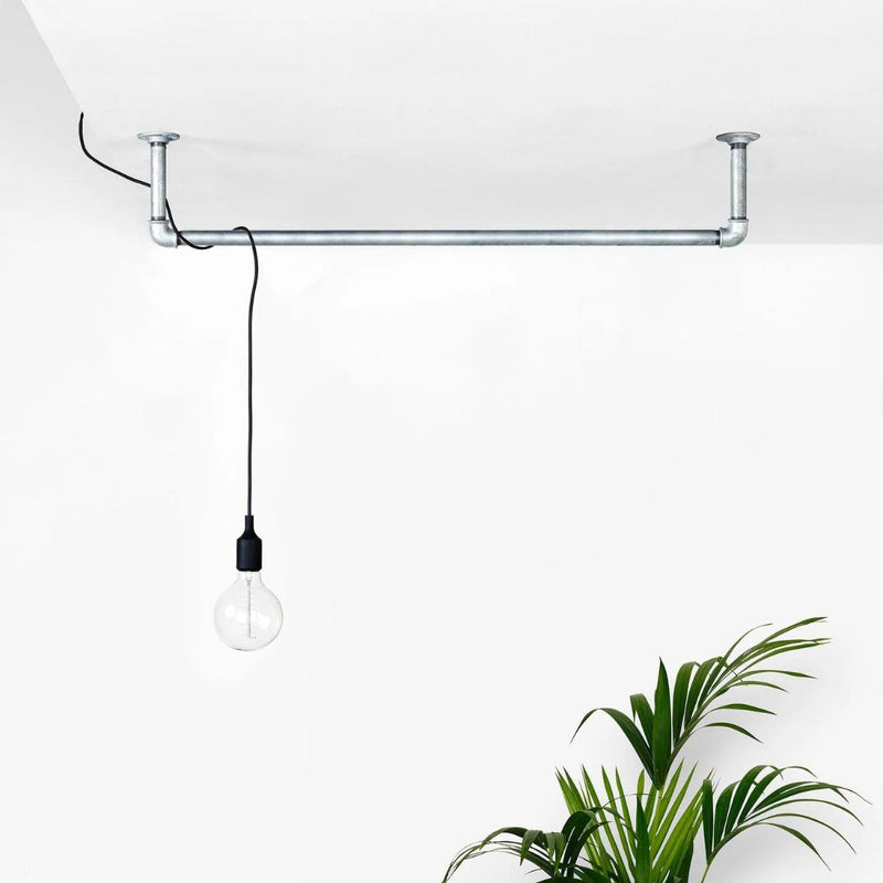 Ceiling mounted silver iron pipes to attach light bulbs for industrial style light fixtures