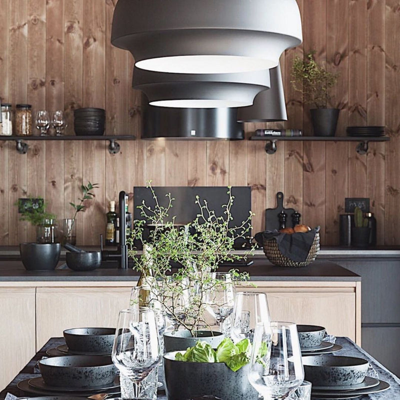 Modern kitchen design with simple floating wall mounted shelves made from wood and iron supports