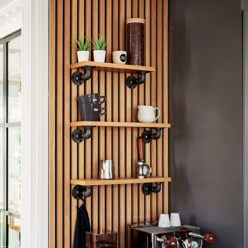 Small coffee corner made from floating shelves using water pipe supports and oak shelves