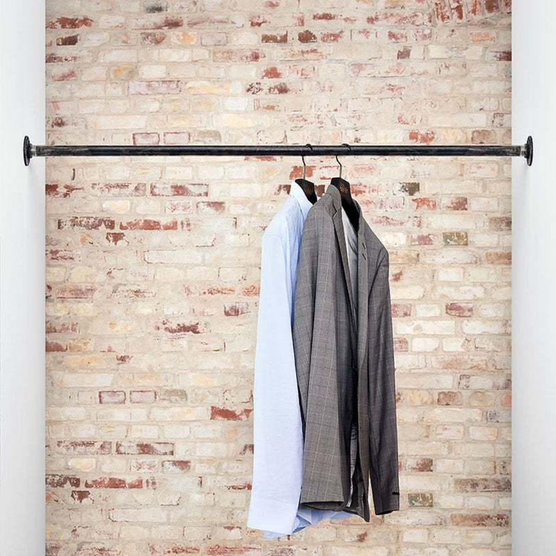 industrial design clothes rail made from dark water pipes to attach between two walls
