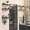 modern kitchen set up with industrial water pipe rails for towels and shelves on top for decoration