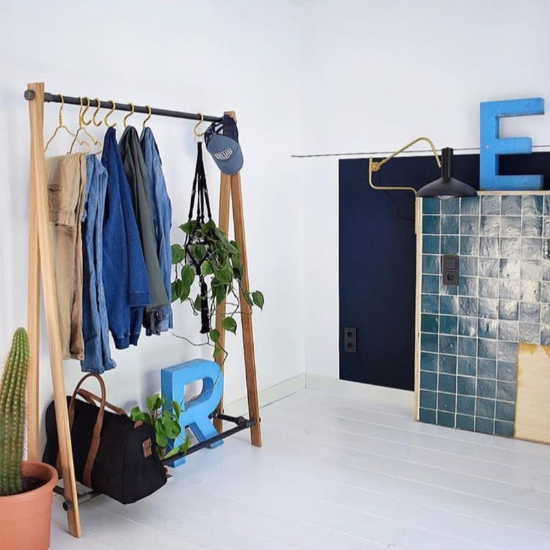 free standing clothes rack as open closet to hang clothes with shoe rack for bags industrial design